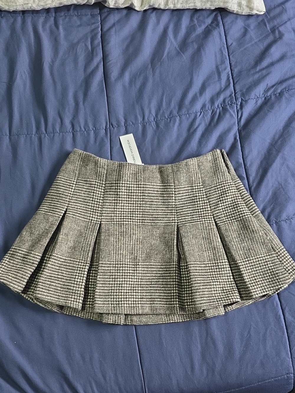 naked wardrobe Black & White Plaid Pleated Mini Skirt